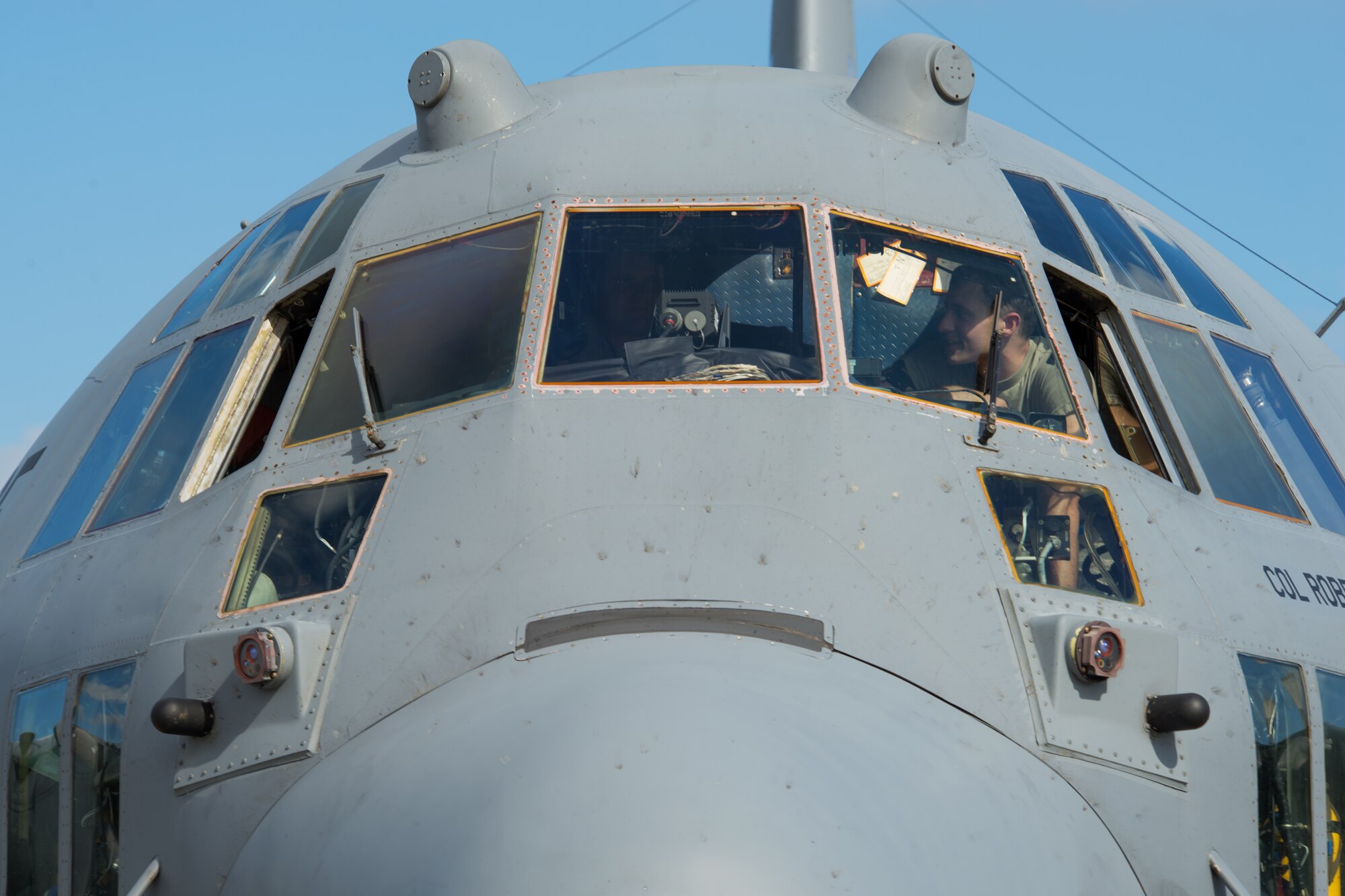 Airman 1st Class David Saraj, right, 374th Aircraft Maintenance Squadron crew chief, maintains inside of a C-130 Hercules at Yokota Air Base, Japan, Oct. 7, 2013. Airmen are performing a number of exercise tasks as Yokota conducts a Readiness Week. (U.S. Air Force photo by Osakabe Yasuo/Released)