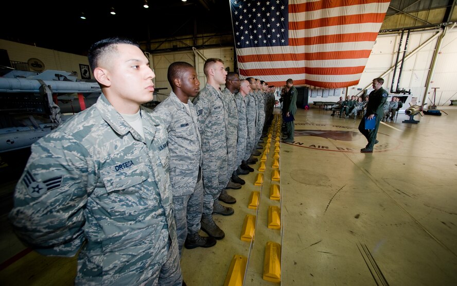 Crew chiefs from the 8th Aircraft Maintenance Squadron wait for their pilots at Kunsan Air Base, Republic of Korea, Oct. 4, 2013. Forty-four maintainers were entrusted with F-16 Fighting Falcons during the 2013 Dedicated Crew Chief Ceremony. All 44 Airmen voluntarily took responsibility of their aircraft.  A dedicated crew chief is the last to see the pilot go, the first to receive them and ensures the aircraft is prepared to complete its mission. (U.S. Air Force photo by Senior Airman Armando A. Schwier-Morales/Released)