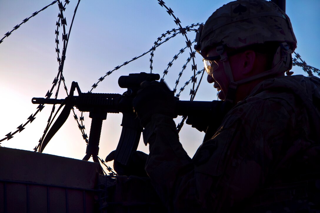 U.S. Army Sgt. 1st Class Shawn L. Brothers pulls security during a battle drill on Forward Operating Base Lightning in Paktia province, Afghanistan, Oct. 2, 2013. Brothers, a paralegal non-commissioned officer, is assigned to the 101st Airborne Division's 4th Brigade Combat Team.