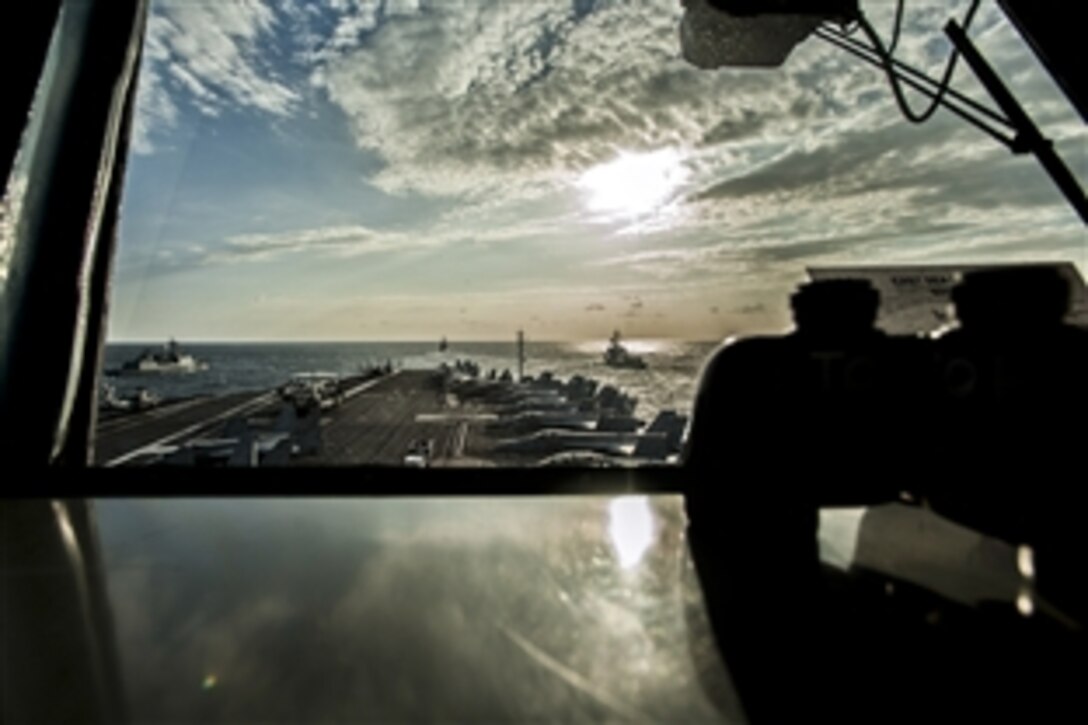 South Korean and U.S. Navy ships steam next to the U.S. Navy's forward-deployed aircraft carrier USS George Washington during an exercise off the Korean Peninsula, Oct. 3, 2013. The George Washington Carrier Strike Group is conducting exercises with the South Korean navy to strengthen maritime interoperability and the U.S.-South Korean alliance. 