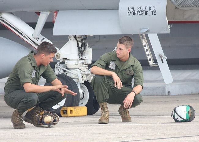 Marines with Marine Fighter Attack Squadron 112 preform maintenance on an aircraft, Royal Malaysian Air Force Base Butterworth, Malaysia. The Cowboys returned to Iwakuni and are prepareing for their next deployment. 