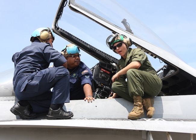 Marines with Marine Fighter Attack Squadron 112 preform maintenance to an aircraft, Royal Malaysian Air Force Base Butterworth, Malaysia. VMFA-112 is currently in Iwakuni preparing for its next deployment. 