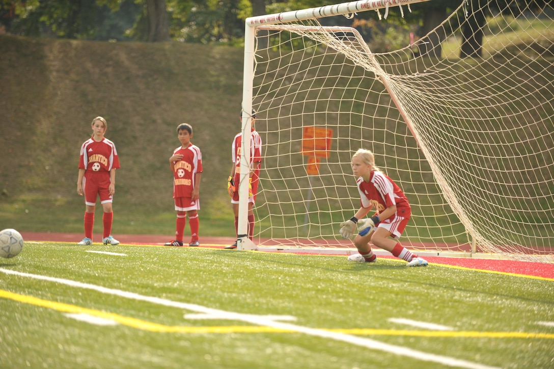 Carson, 13, goalie for the middle school co-ed soccer team from Quantico Middle/High School, prepares to block a ball during a match against the Boys Middle School Soccer  from Fredericksburg Academy at Butler Stadium aboard Marine Corps Base Quantico on Oct. 3, 2013. Quantico tied their game with Fredericksburg Academy 0-0. (Marine Corps photo by Lance Cpl. Cuong Le/ Released)