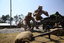 Marine students of the Battle Skills Training School machine gunner course with 2nd Marine Logistics Group dive for an M240B medium machine gun during a simulated enemy attack prior to a live-fire exercise aboard Camp Lejeune, N.C., Oct. 4, 2013. The service members learned the characteristics; including maximum ranges, rates of fire and the nomenclature, of M240Bs, MK19 Grenade launchers and M2 Browning .50-caliber machine guns. 
