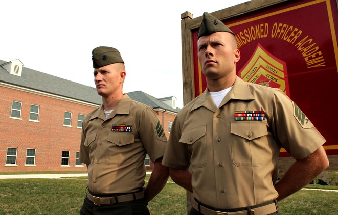 Sgt. Kelly Piper (left), amphibious vehicle operator at Marine Corps Systems Command aboard Marine Corps Base Quantico, received the “Honor Graduate” and “Sgt. Maj. Dan Daly” Award at the Sergeants Course Class 6-13 graduation ceremony Oct. 4, 2013, at Staff Noncommissioned Officer Academy. Sgt. Dustin Lavery, engineer equipment operator at Headquarters and Service Battalion at Marine Corps Recruit Depot Parris Island, received the “Gung Ho” award for his motivation, cooperation and esprit de corps during the course. 