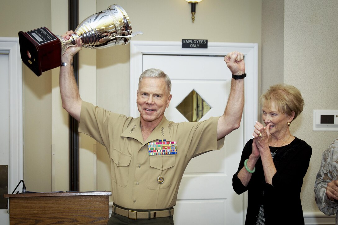 The 35th commandant and first lady of the Marine Corps, General and Mrs. James F. Amos, attend and participate in a Wounded Warrior Regiment hosted luncheon in honor of Ronny Porta, Operation Iraqi Freedom veteran, at the Clubs at Quantico, Marine Corps Base Quantico, on October 3, 2013. (U.S. Marine Corps photo by Sgt. Mallory S. VanderSchans)(RELEASED)

