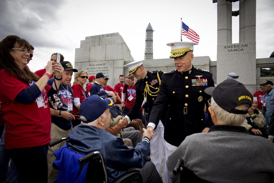 The 35th commandant of the Marine Corps, General James F. Amos, meets with World War II Veterans during the Honor Flight event at the World War II Memorial  in Washington, D.C., September 28, 2013. (U.S. Marine Corps photo by Sgt. Mallory S. VanderSchans)(RELEASED)
