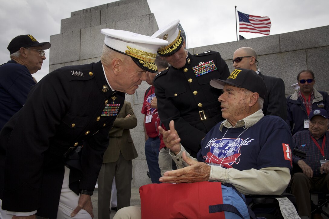 The 35th commandant of the Marine Corps, General James F. Amos, meets with World War II Veterans during the Honor Flight event at the World War II Memorial  in Washington, D.C., September 28, 2013. (U.S. Marine Corps photo by Sgt. Mallory S. VanderSchans)(RELEASED)
