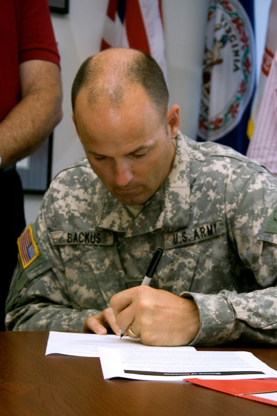 2009 - NORFOLK -- Colonel Andrew Backus signs the oyster Record of Decision. 