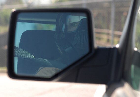 Senior Airman Mark McRory, 303rd Intelligence Squadron language analyst, drives in mission oriented protective posture gear during a lock-in training event at Osan Air Base, Republic of Korea, Oct. 4, 2013. Four Airmen representing the squadrons from the 694th Intelligence, Surveillance and Reconnaissance Group participated in MOPP 4 driver training to ensure all requirements for contingency operations were met. (U.S. Air Force photo/1st Lt. Kay M. Nissen)