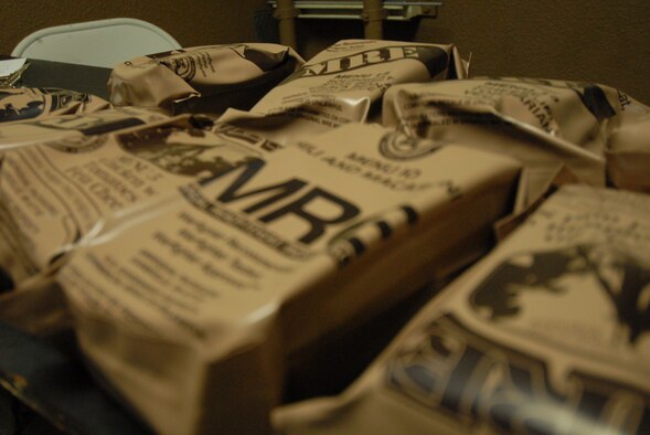 Meals-Ready-to-Eat are set out for intelligence Airmen from the 694th Intelligence, Surveillance and Reconnaissance Group who participated in a 24-hour lock-in training event at Osan Air Base, Republic of Korea, Oct. 3, 2014. The lock-in tested the ability of the intelligence center and intelligence Airmen to perform in sustained contingency operations. (U.S. Air Force photo/1st Lt. Kay M. Nissen)