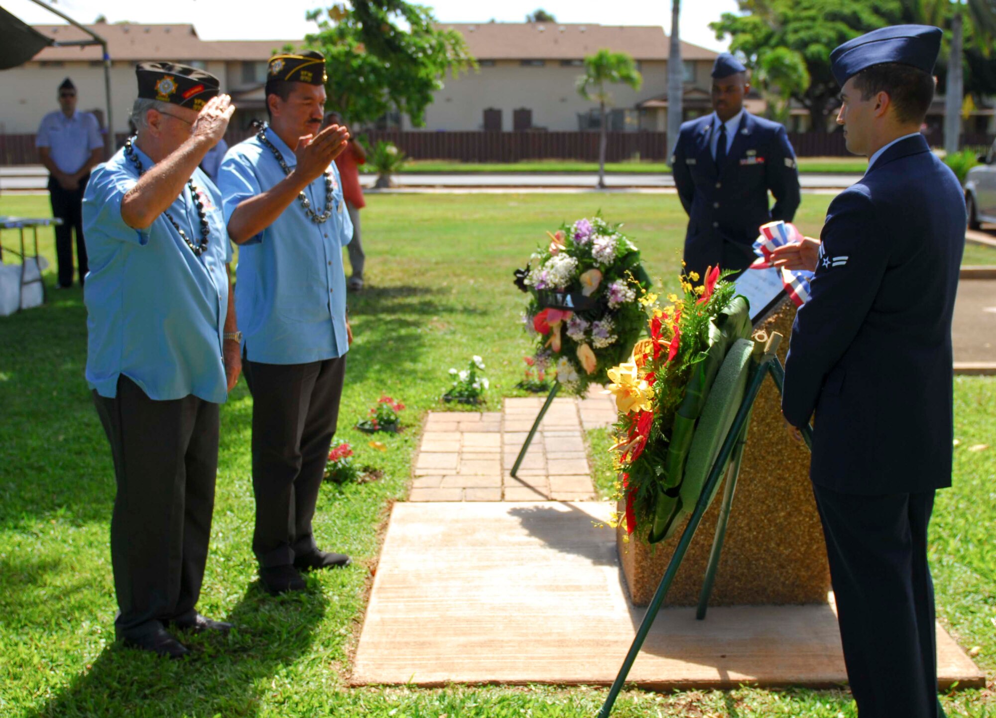 Members of Veterans of Foreign Wars Post 907 salute the newly dedicated Operation Homecoming memorial at the rededication ceremony at Joint Base Pearl Harbor-Hickam, Hawaii, on Oct. 7, 2013. The ceremony was to commemorate and pay tribute to the American spirit, teamwork, optimism, courage and sacrifice of those who were held as prisoners of war during the Vietnam War. (U.S. Air Force photo/Wiley Moore)