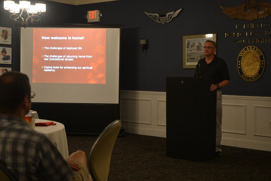 U.S. Air Force Maj. David Knight, 20th Fighter Wing chaplain, speaks about spiritual resiliency tools available during deployments, while at a dinner with military members and spouses, Shaw Air Force Base, S.C., Oct. 4, 2013. A total of 19 individuals participated in the event where they were treated to food and a conversation on spiritual resiliency. (U.S. Air Force photo by Airman 1st Class Ashley L. Gardner/Released) 
