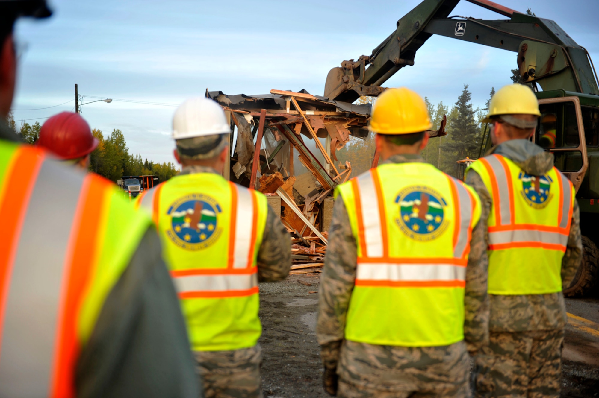 Dirt Boyz' from the 773rd Civil Engineer Group tear down Building 45000 on Joint Base Elmendorf-Richardson, Sept. 28. The building was once a manned guard shack for individuals to travel between Fort Richardson and Elmendorf Air Force base, prior to joint basing in 2010. (U.S. Air Force photo/Airman 1st Class Tammie Ramsouer)