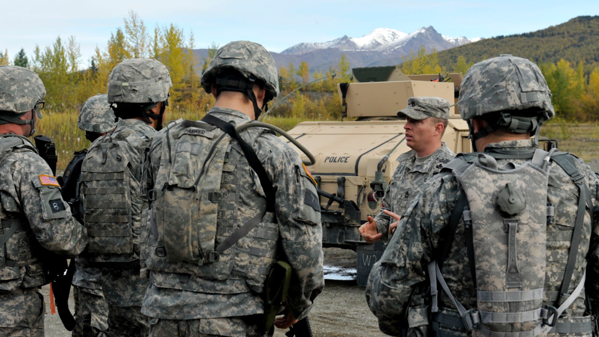 Army Master Sgt. Justin Shaffer, 207th Multi-Functional Training Regiment deputy commandant, communicates the rules to contestants for the shooting event during the 2014 Alaskan National Guard Best Warrior Competition on Joint Base Elmendorf-Richardson Sept. 28. The shooting portion of the competition tested their skills to think and react quickly by shooting with five different weapons and finish the course within five minutes. (U.S. Air Force photo/Airman 1st Class Tammie Ramsouer)