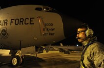 Senior Airman Brandon Zirbel, 92nd Aircraft Maintenance Squadron hydraulics specialist, stands ground while the KC-135 Stratotanker engines start on the flightline at Fairchild Air Force Base, Wash., Sept. 25, 2013. (U.S. Air Force photo by Airman 1st Class Janelle Patiño/Released)