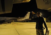 Senior Airman Austin Reeh, 92nd Aircraft Maintenance Squadron hydraulics specialist, performs an engine inlet and exhaust inspection on a KC-135 Stratotanker on the flightline at Fairchild Air Force Base, Wash., Sept. 25, 2013. It is required for Airmen to perform multiple inspections prior to starting the engines of any aircraft. (U.S. Air Force photo by Airman 1st Class Janelle Patiño/Released)