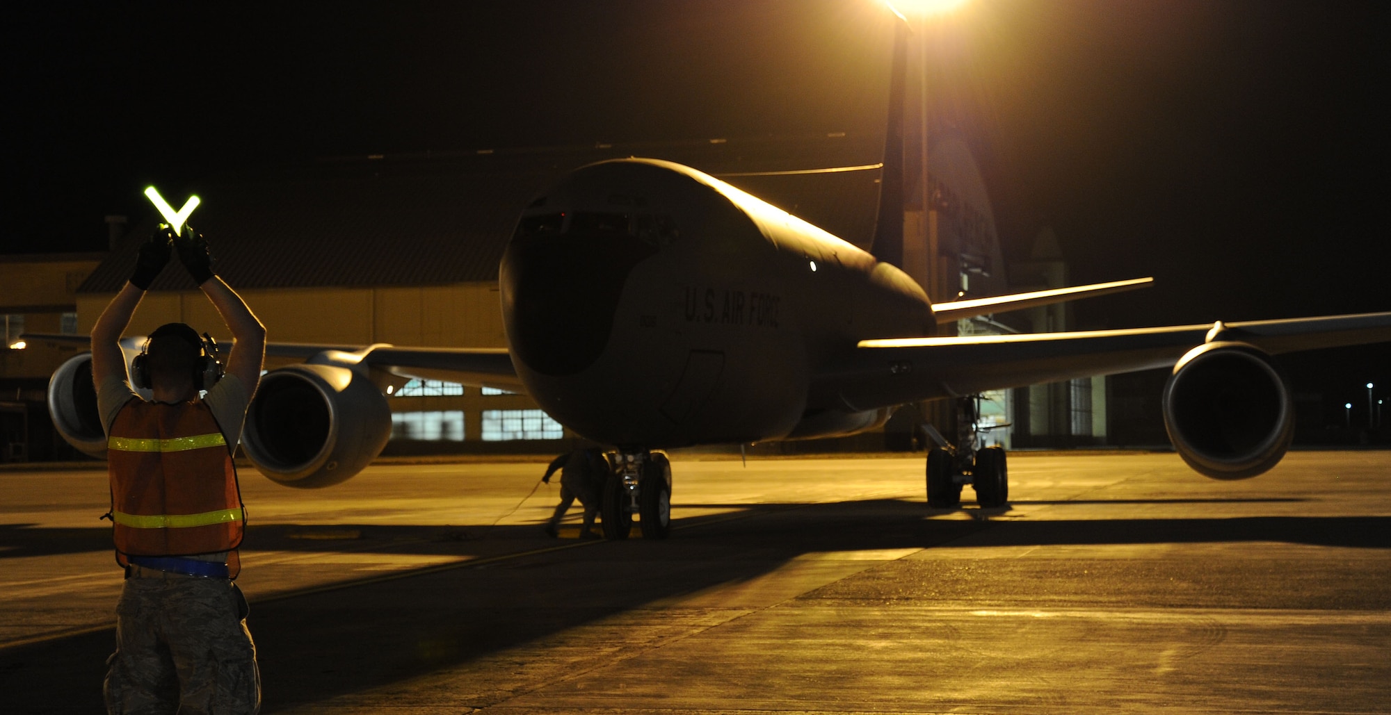 Senior Airman Jonathan Blair, 92nd Aircraft Maintenance Squadron crew chief, marshals in a KC-135 Stratotanker at Fairchild Air Force Base, Wash., Sept. 25, 2013. (U.S. Air Force photo by Airman 1st Class Janelle Patiño/Released)