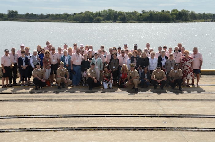 USS Tiru (SS-416) reunion group poses with the entourage of Naval Support Activity Charleston shipmates who participated in the public affairs-guided tour of the Weapons Station at Wharf Alpha Sept. 28, 2013. (U.S. Navy photo/ Petty Officer 2nd Class Chad Hallford)