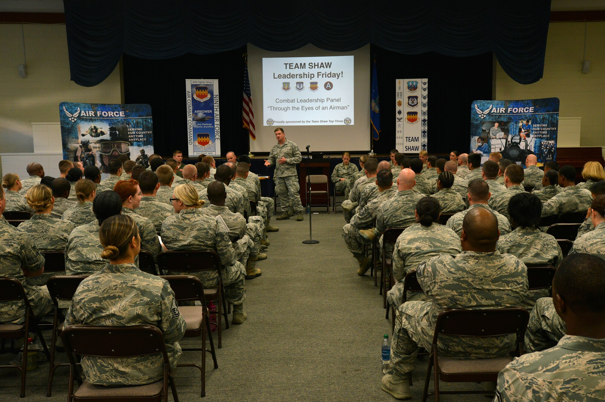 U.S. Air Force Airmen sit and listen during a combat and deployment-leadership event, Shaw Air Force Base S.C, Oct. 4, 2013.  The event was held to help Airmen gain the knowledge and advice from fellow Airmen that have deployed and dealt with combat and its stressors. (U.S. Air Force photo by Airman 1st Class Jensen Stidham/ Released)