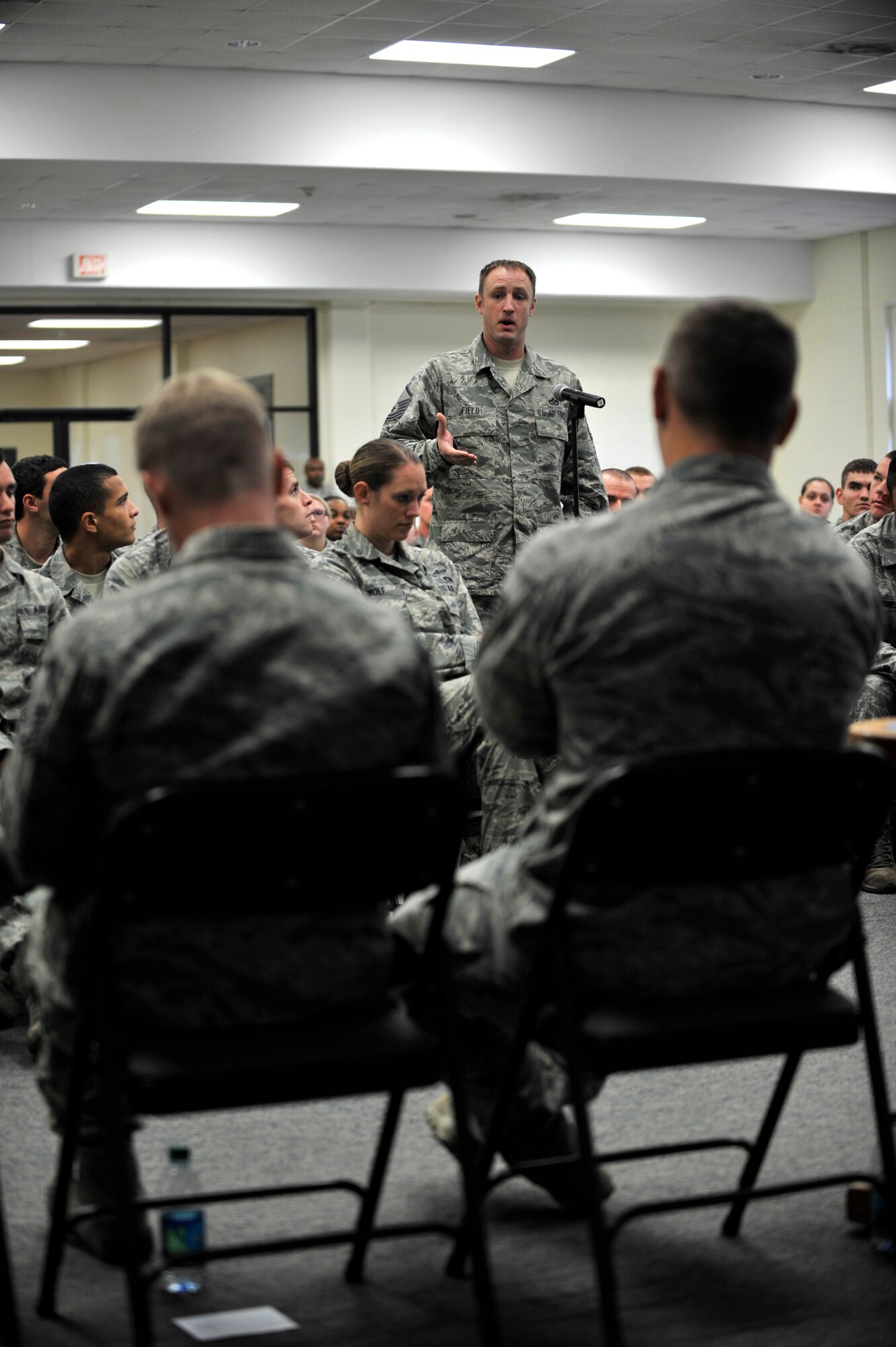 U.S. Air Force Master Sgt. Erik Field, 20th Fighter Wing NCOIC Signature Management, asks a question to a panel of Airmen during a combat and deployment-leadership event, Shaw Air Force Base S.C, Oct. 4, 2013.  The event was held to help Airmen gain the knowledge and advice from fellow Airmen that have deployed and dealt with combat and its stressors. (U.S. Air Force photo by Airman 1st Class Jensen Stidham/ Released)