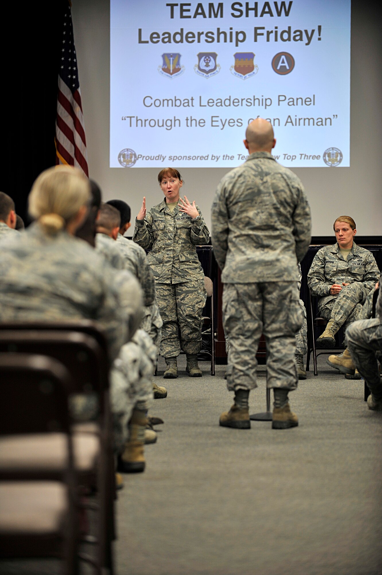 U.S. Air Force Master Sgt. Julie Moretto, Third Army 18th Weather Squadron, plans and requirements manager, answers a question during a combat and deployment-leadership event, Shaw Air Force Base S.C, Oct. 4, 2013.  The event was held to help Airmen gain the knowledge and advice from fellow Airmen that have deployed and dealt with combat and its stressors. (U.S. Air Force photo by Airman 1st Class Jensen Stidham/ Released)