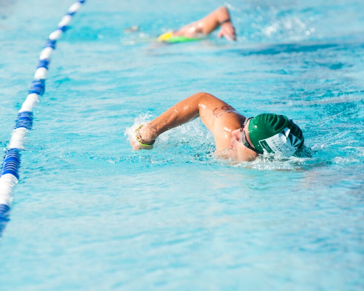 A member of Team Holloman begins the 700 meter swimming portion of the annual Triathlon at Holloman Air Force Base, N.M., Oct. 5. The athletes took part in a 5k run, 30k bike and a 700 meter swim to complete the race. (U.S. Air Force photo by Airman 1st Class Daniel E. Liddicoet/Released)