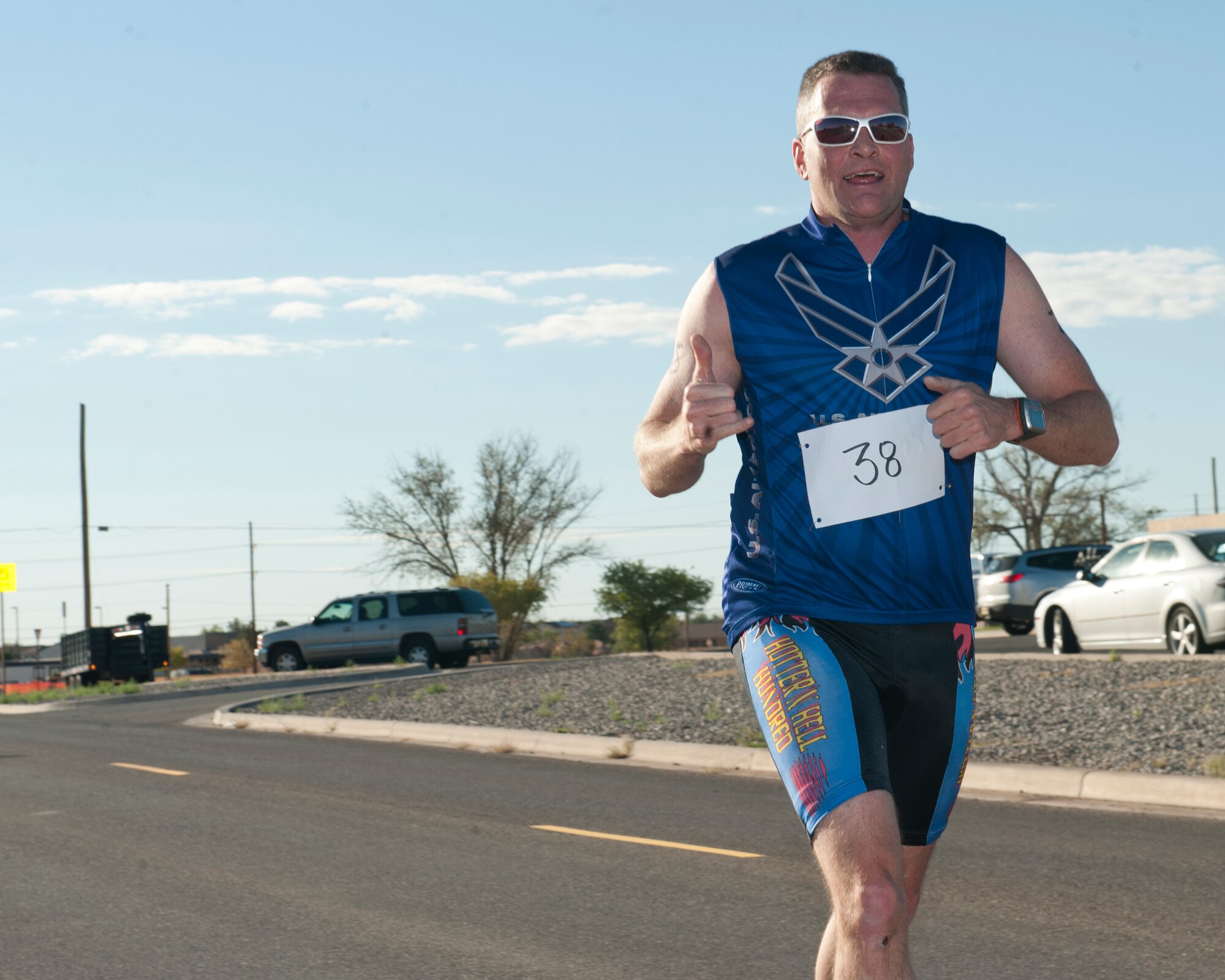 Colonel Kenneth Johnson, 49th Operations Group commander, finishes the 5K portion of the annual Triathlon at Holloman Air Force Base, N.M., Oct. 5. The athletes took part in a 5k run, 30k bike and a 700 meter swim to complete the race. (U.S. Air Force photo by Airman 1st Class Daniel E. Liddicoet/Released