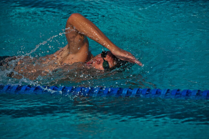 A member of Team Holloman begins the 700 meter swimming portion of the annual Triathlon at Holloman Air Force Base, N.M., Oct. 5. The athletes took part in a 5k run, 30k bike and a 700 meter swim to complete the race. (U.S. Air Force photo by Airman 1st Class Aaron Montoya/Released)