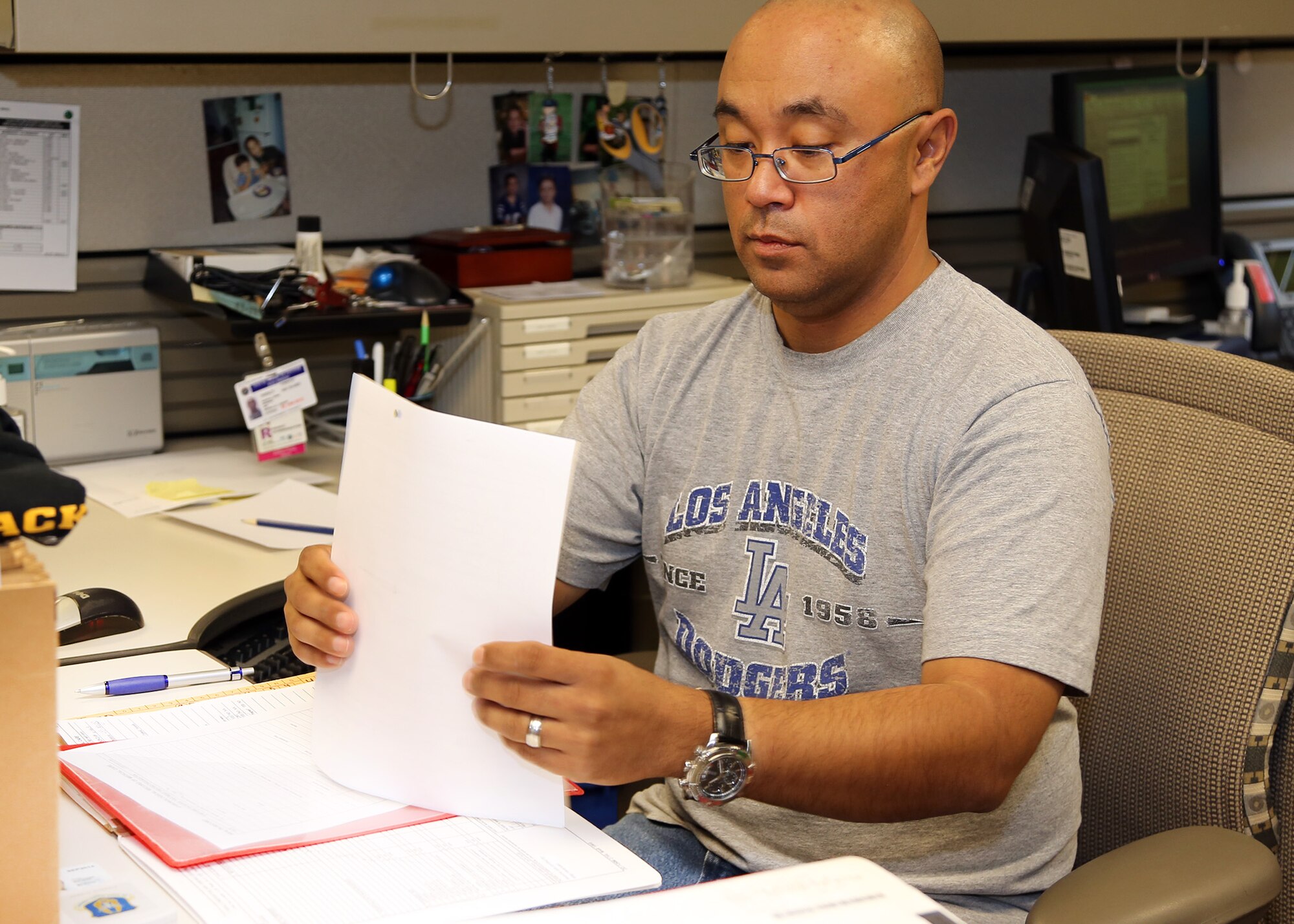 Senior Master Sgt. Richard Griego, a dual-status Air Reserve Technician with the 349th Aerospace Medicine Squadron, reviews Reservists' medical records to ensure deployment readiness, at Travis Air Force Base, Calif., Oct 7, 2013.  Griego was one of the 349th Air Mobility Wing full-time members who returned to work here today. More than 360 of the wing's full-time cadre were idled last week as a part of a furlough of government employees.  ARTs such as Griego maintain status as both Air Force Reservists and Department of Defense civil service employees, ensuring leadership and continuity of Reserve units are provided by Reservists. (U.S. Air Force photo / Lt. Col. Robert Couse-Baker)