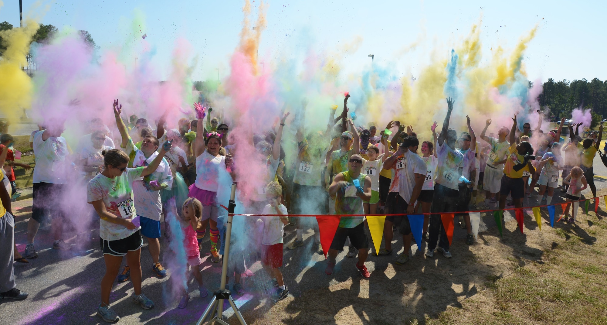 About 250 participants of the Shut Up and Color Run 5K join in a "color explosion," throwing different colored powders into the air, Shaw Air Force Base, S.C., Oct. 5, 2013. The 20th Force Support Squadron held Shaw's first Shut Up and Color Run, in which the participants were doused in colored powder. (U.S. Air Force photo by Senior Airman Tabatha Zarrella/Released)
