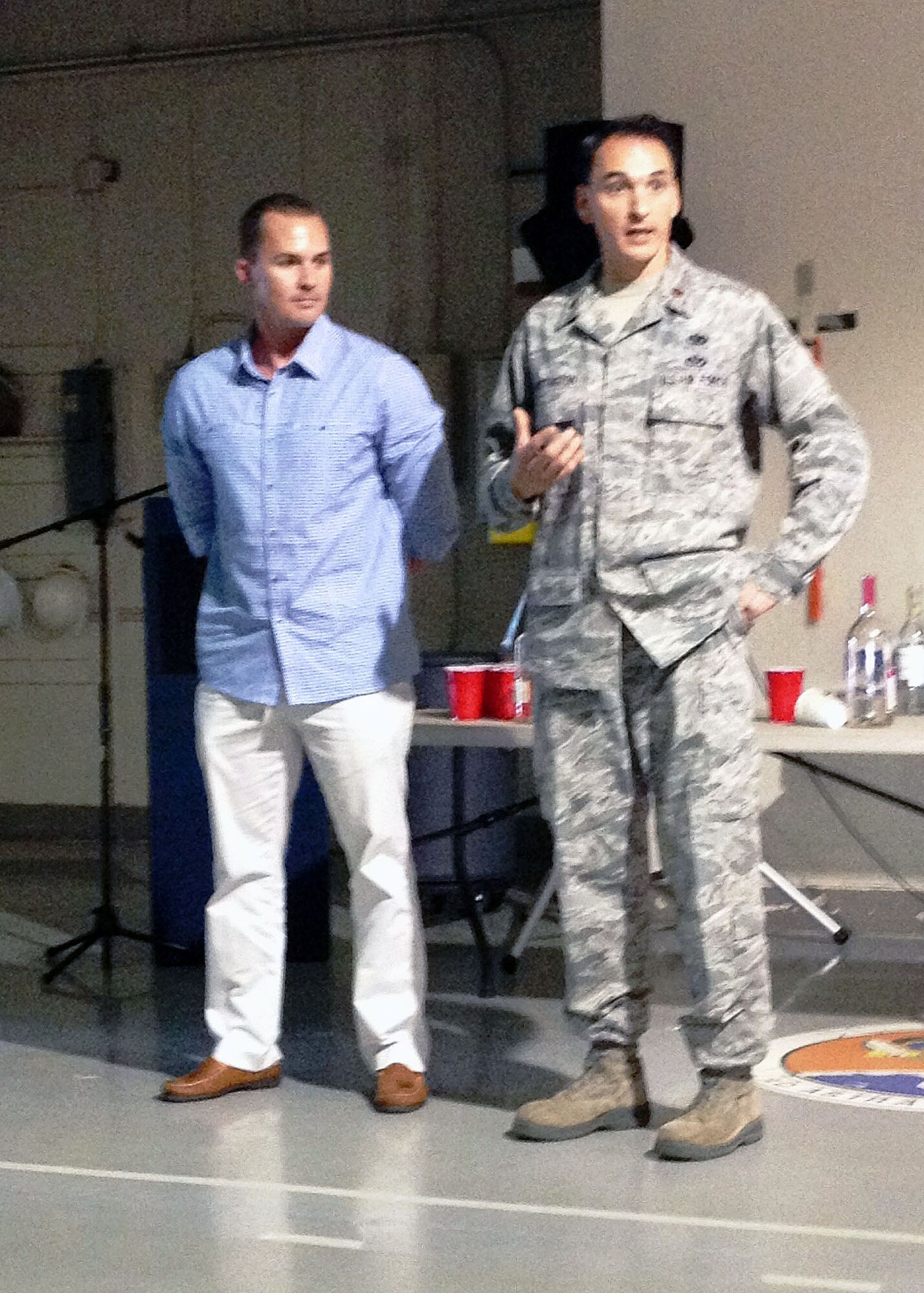 Mr. John Templeton, left, from Dunedin, Fla., shares details of his vehicular manslaughter incident and subsequent conviction to 3rd Aerial Port Squadron Airmen and Maj. Joseph Whittington, right, 3rd Aerial Port Squadron commander on Oct 2 at Pope Army Airfield, Fort Bragg, N.C. Maj. Whittington presented Mr. Templeton with his commander’s coin in appreciation of his emotional presentation to his squadron Airmen, educating them about the consequences of drinking and driving. (U.S. Air Force photo/2nd Lt. Henry Kehs)
