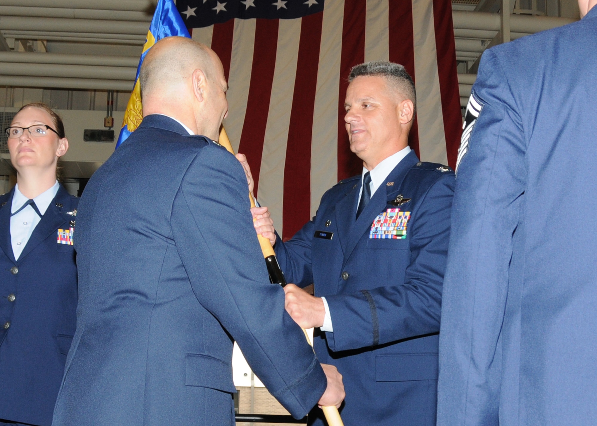 Lieutenant Colonel Anthony Hamel, incoming Commander of the 143d Mission Support Group, assumes Command from Col Arthur Floru, 143d Airlift Wing Commander, during a Change of Command ceremony for the 143d MSG. National Guard Photo by Technical Sergeant Jason Long