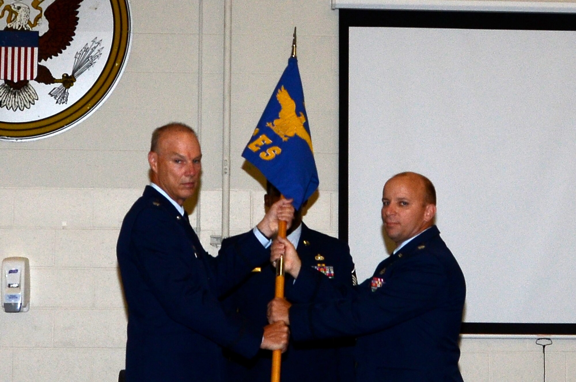 WRIGHT-PATTERSON AIR FORCE BASE, Ohio – Lt. Col. Dale Bateman, 445th Mission Support Group commander, passes the guidon to Lt. Col. Jason Shroyer, incoming 445th Civil Engineer Squadron commander, during an Appointment of Command ceremony Sept. 8. (U.S. Air Force photo/Tech. Sgt. Anthony Springer)