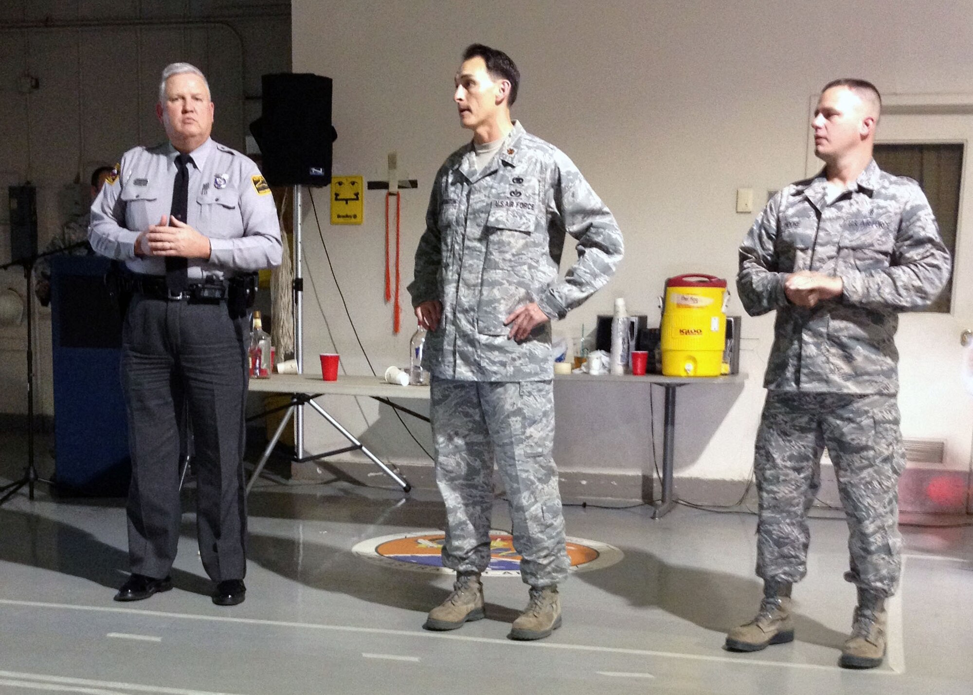 Trooper Jimmy Williams, North Carolina State Highway Patrol, left, talks about driving while under the influence of alcohol to 3rd Aerial Port Squadron Airmen with Maj. Joseph Whittington, 3rd Aerial Port Squadron commander, middle, and Master Sgt. David Moore, 43rd Logistics Readiness Squadron first sergeant on Oct 2 at Pope Army Airfield, Fort Bragg, N.C.  (U.S. Air Force photo/2nd Lt. Henry Kehs)