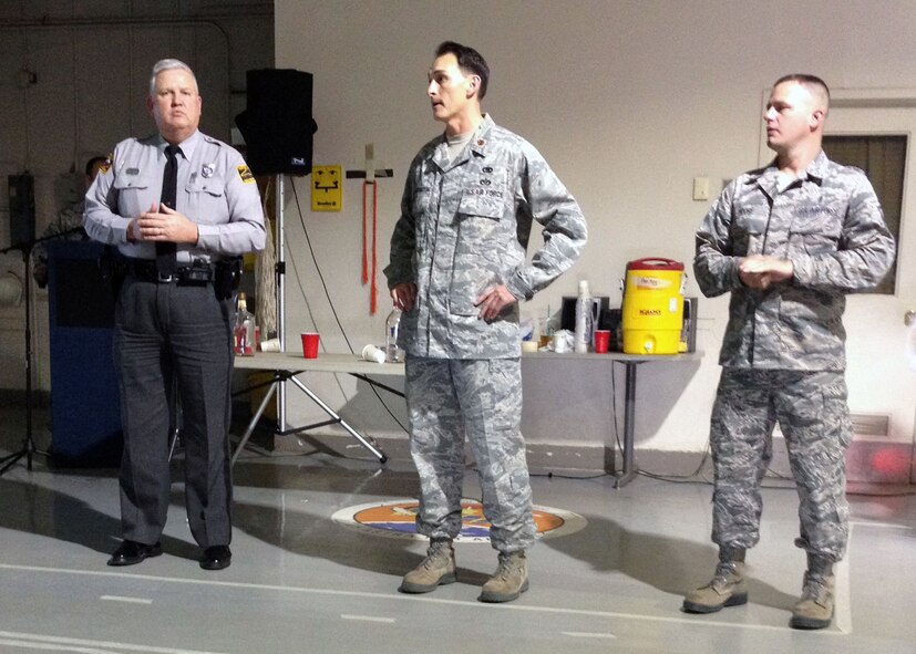 Trooper Jimmy Williams, North Carolina State Highway Patrol, left, talks about driving while under the influence of alcohol to 3rd Aerial Port Squadron Airmen with Maj. Joseph Whittington, 3rd Aerial Port Squadron commander, middle, and Master Sgt. David Moore, 43rd Logistics Readiness Squadron first sergeant on Oct 2 at Pope Army Airfield, Fort Bragg, N.C.  (U.S. Air Force photo/2nd Lt. Henry Kehs)