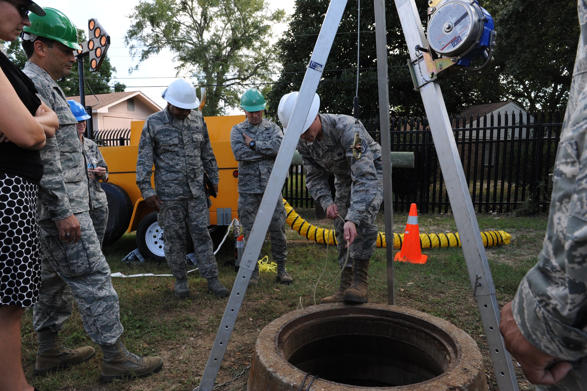 Staff Sgt. Jamie Felkins, 85th Engineering Installation Squadron, briefs 81st Training Wing leadership on the proper use of wench equipment during the 85th EIS open house Oct. 3, 2013, Keesler Air Force Base, Miss. The open house was held to educate leadership on the unique services and day-to-day operations of the Air Force’s only active duty engineering installation squadron. (U.S. Air Force photo by Airman 1st Class Stephan Coleman)