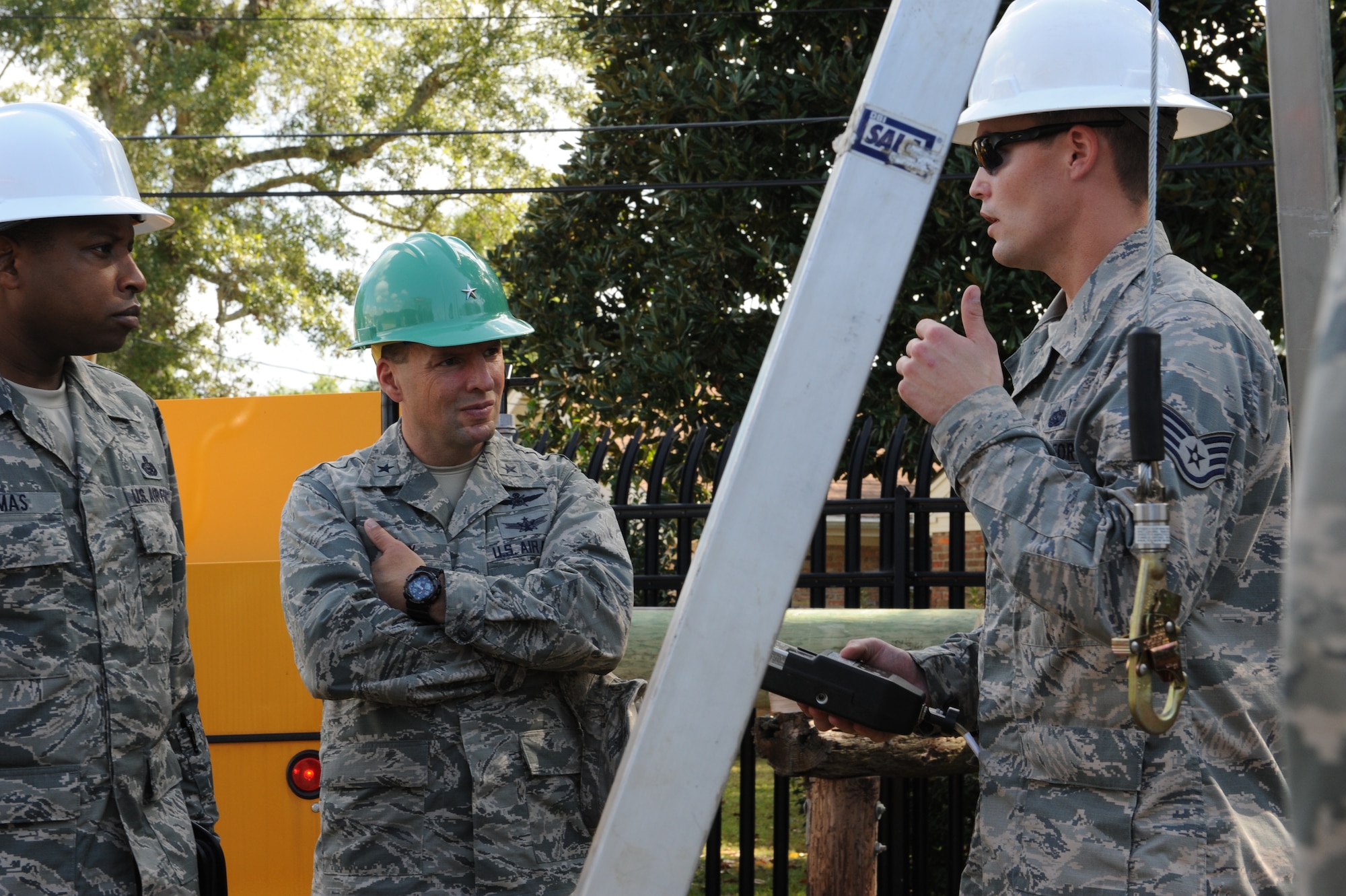 Staff Sgt. Jamie Felkins, 85th Engineering Installation Squadron, briefs Chief Master Sgt. Farrell Thomas, 81st Training Wing command chief, and Brig. Gen. Patrick Higby, 81st TRW commander, during the 85th EIS open house Oct. 3, 2013, Keesler Air Force Base, Miss. The open house was held to educate leadership on the unique services and day-to-day operations of the Air Force’s only active duty engineering installation squadron. (U.S. Air Force photo by Airman 1st Class Stephan Coleman)