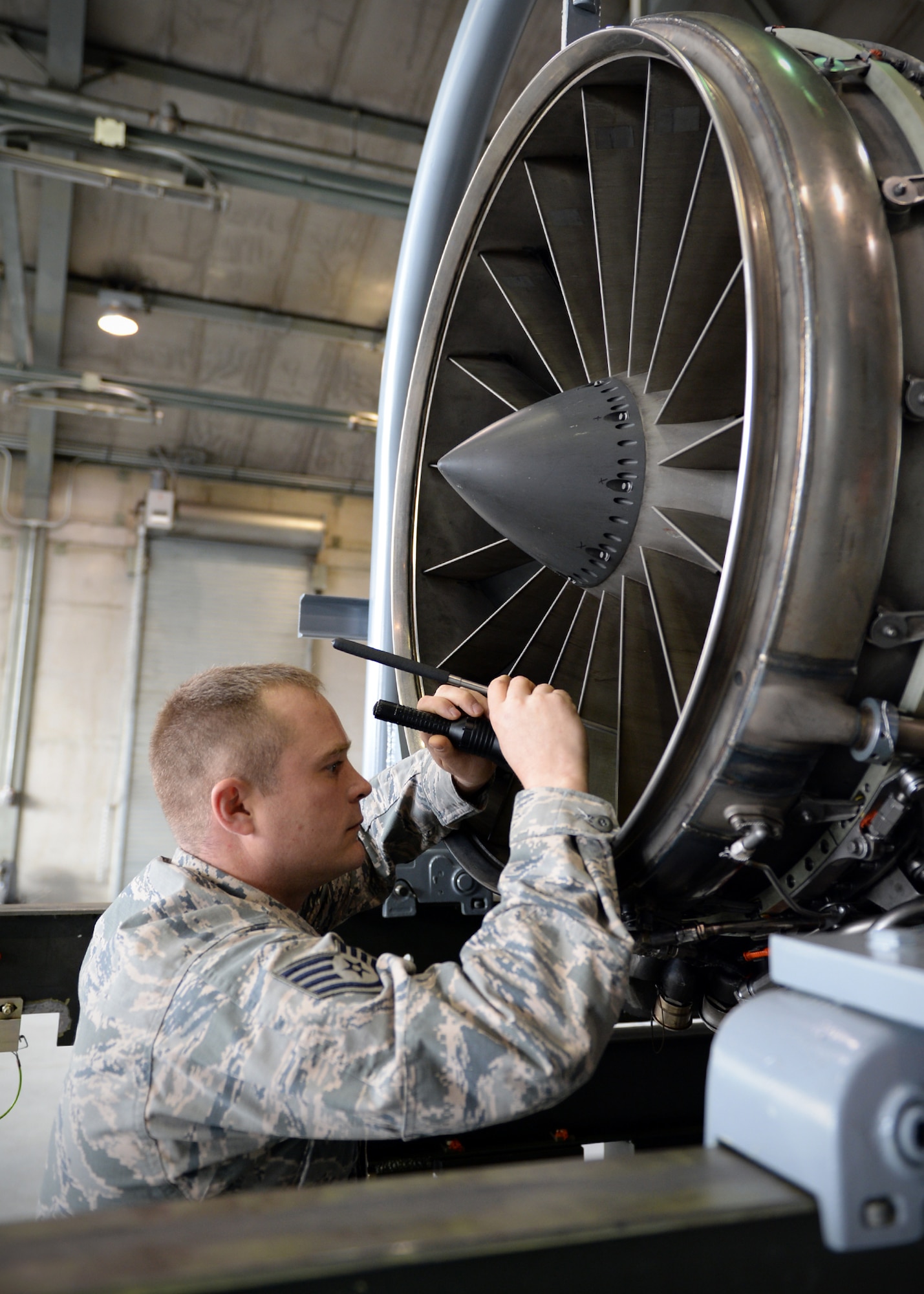 Staff Sgt. Christopher Brock, 354th MXS aerospace propulsion craftsman, inspects the fan blades on an engine from an F-16 Fighting Falcon after a test at the “Hush House” Oct. 3, 2013, Eielson Air Force Base, Alaska. After every test, engines are re-inspected prior to being used in the jets by the 18th Aggressor Squadron during RED FLAG-Alaska and training. (U.S. Air Force photo by Senior Airman Shawn Nickel/Released)