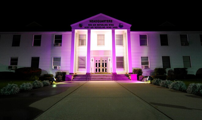 The wing headquarters building, nicknamed “The White House” due to its white appearance, is illuminated with a purple glow to signify Domestic Violence Awareness month at Fairchild Air Force Base, Wash., Oct. 8, 2013. (U.S. Air Force photo by Airman 1st Class Ryan Zeski/Released)