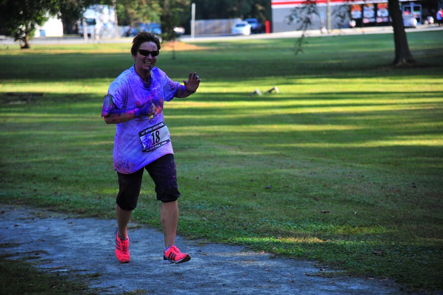 U.S. Air Force Col. Eleanor Nazar-Smith, 4th Medical Group commander, runs during the Wife Appreciation Run (WAR) in Goldsboro, N.C., Oct. 5, 2013. Members of Team Seymour and the local community came together to support the WAR against domestic violence. (U.S. Air Force photo by Senior Airman Aubrey White)