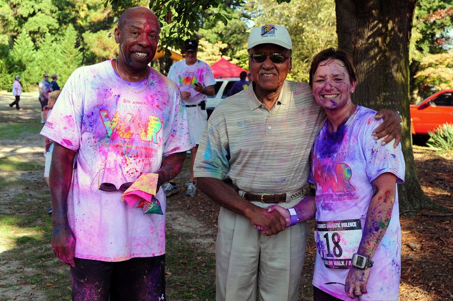 From the left, Jerome Ellis, 4th Medical Operations Squadron Family Advocacy outreach manager, Mayor Al King, City of Goldsboro, and U.S. Air Force Col. Eleanor Nazar-Smith, 4th Medical Group commander, congratulate one another after the annual Wife Appreciation Run (WAR) in Goldsboro, N.C., Oct. 5, 2013. This is the fifth year the base has partnered with the greater community to help fight the war against domestic violence. (U.S. Air Force photo by Airman 1st Class John Nieves Camacho)