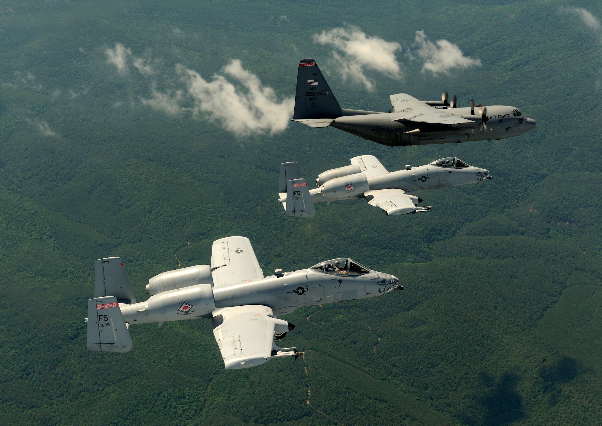 A two-ship of A-10C Thunderbolt II “Warthogs” from the 188th Fighter Wing flies alongside a C-130 Hercules from the 189th Airlift Wing during an exercise with members of the 75th Ranger Regiment near the 188th’s Detachment 1 Razorback Range. Both wings are from the Arkansas Air National Guard. The 188th is based in Fort Smith while the 189th resides on Little Rock Air Force Base. (U.S. Air Force photo by Master Sgt. Ben Bloker/ 2nd Combat Camera Squadron)
