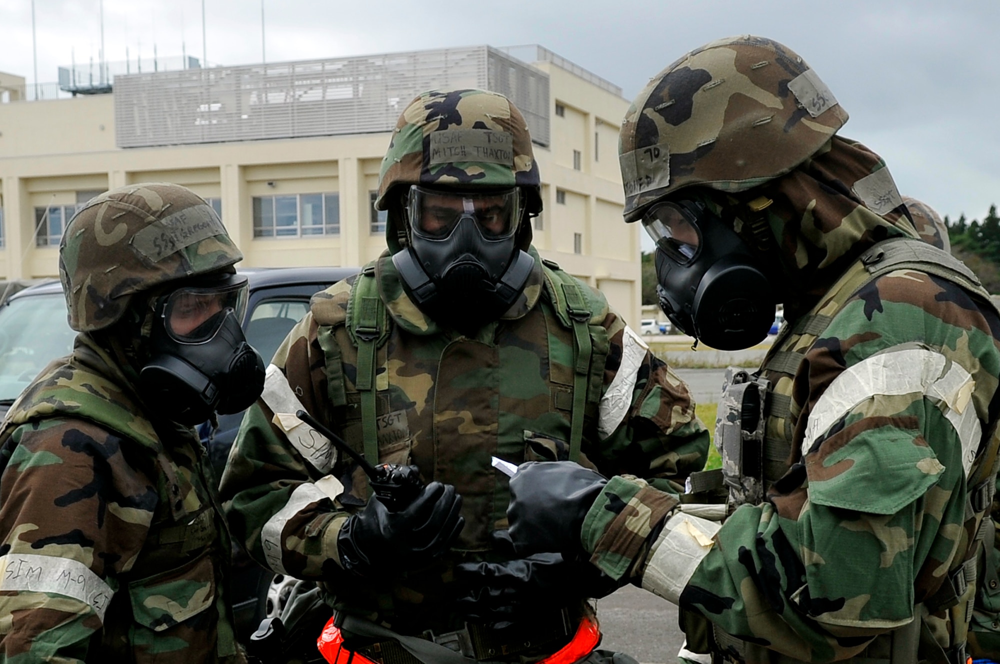 Members of the 35th Civil Engineer Squadron Damage Assessment Response Team receive an infrastructure damage scenario during an Operational Readiness Exercise at Misawa Air Base, Japan, Oct. 7, 2013. DART Airmen here were tested on their ability to respond and assess simulated damage to critical infrastructure around base. (U.S. Air Force photo by Airman 1st Class Zachary Kee) 