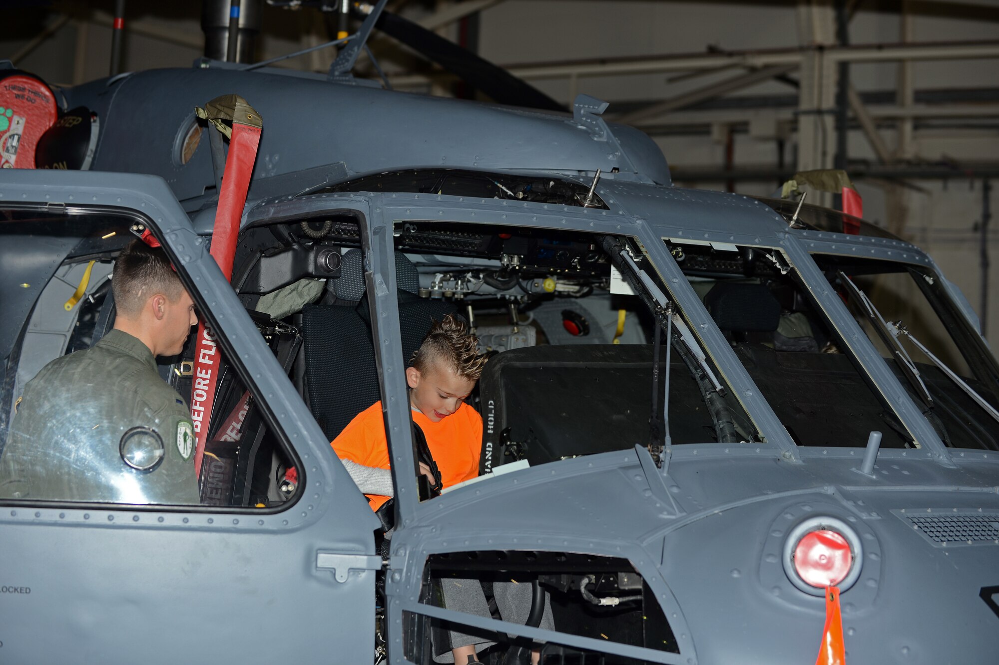 Cameron Fisher, 6, son of Tech. Sgt. Christopher Fisher, 48th Civil Engineer Squadron heavy equipment operator, sits in an HH-60 Pave Hawk during the Day for Kids event at Royal Air Force Lakenheath, England, Sept. 28, 2013. The Day for Kids was an opportunity for children to celebrate being a kid and provide parents with the opportunity to chat with experts regarding health or developmental concerns. (U.S. Air Force photo by Airman 1st Class Trevor T. McBride)