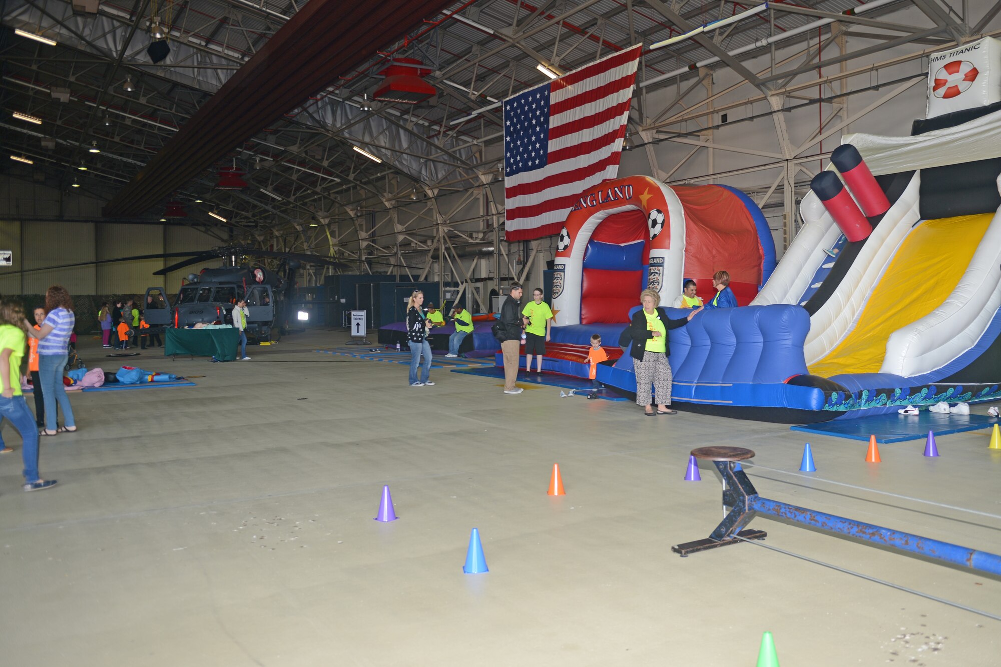 Youth center volunteers interact with children in the Day for Kids event at Royal Air Force Lakenheath, England, Sept. 28, 2013. The Day for Kids was an opportunity for children to celebrate being a kid and provide parents with the opportunity to chat with experts regarding health or developmental concerns. (U.S. Air Force photo by Airman 1st Class Trevor T. McBride)