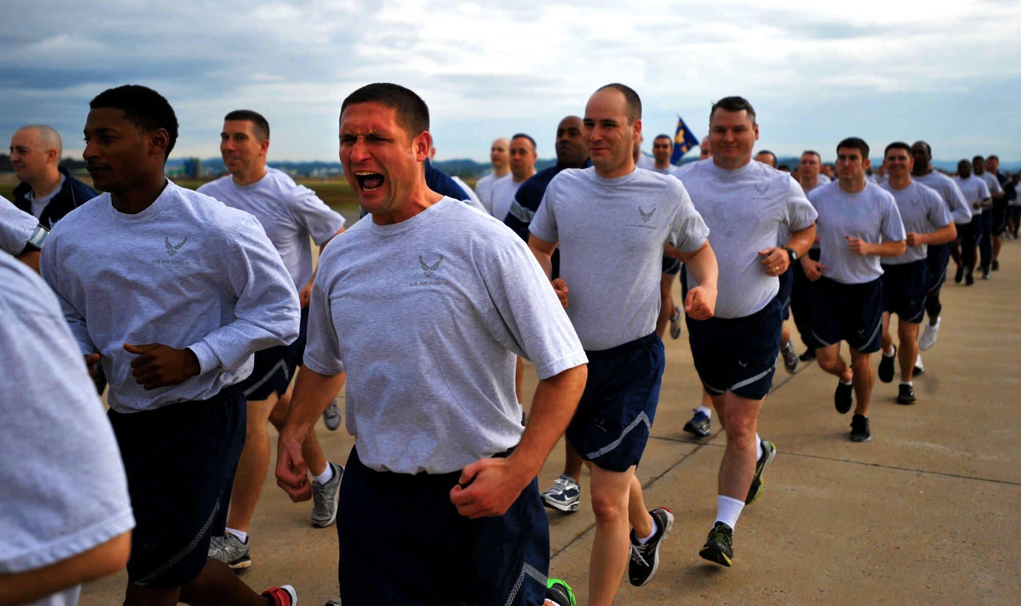 Members of the 607th Air Support Operations Group run in formation during a base-wide 1.5 mile run at Osan Air Base, Republic of Korea, Oct. 7, 2013. Squadrons and tenant units from across the base participated in the 1.5 mile run that took place on the flight line. (U.S. Air Force photo/Senior Airman Siuta B. Ika)