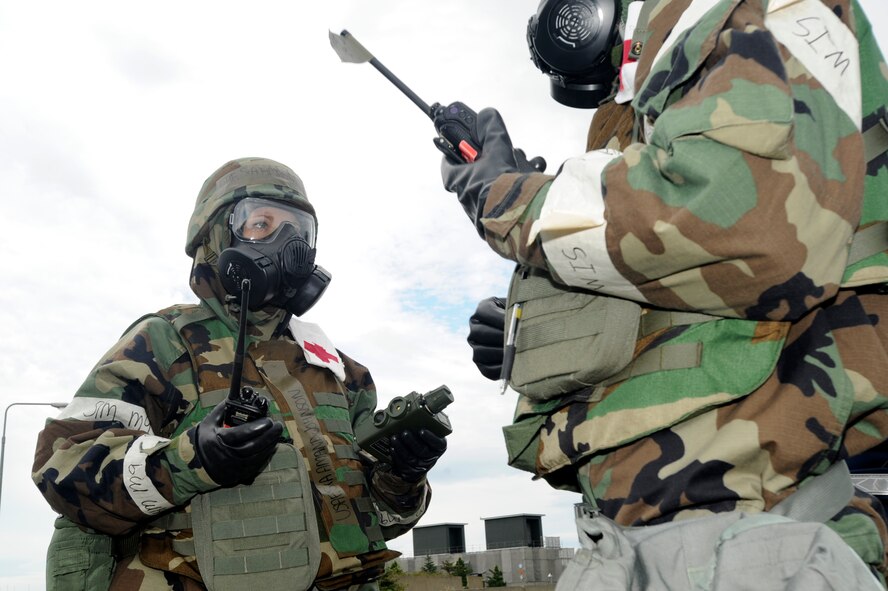 U.S. Air Force Senior Airman Amanda Johnson, 35th Aerospace Medical Squadron, tests the air for potential chemical contamination during an Operational Readiness Exercise at Misawa Air Base, Japan, Oct. 8, 2013. Johnson is one of 11 Airmen in the Bioenvironmental Engineering flight who provide contamination information to the emergency operations center for risk assessment. (U.S. Air Force photo by Staff Sgt. Tong Duong)
