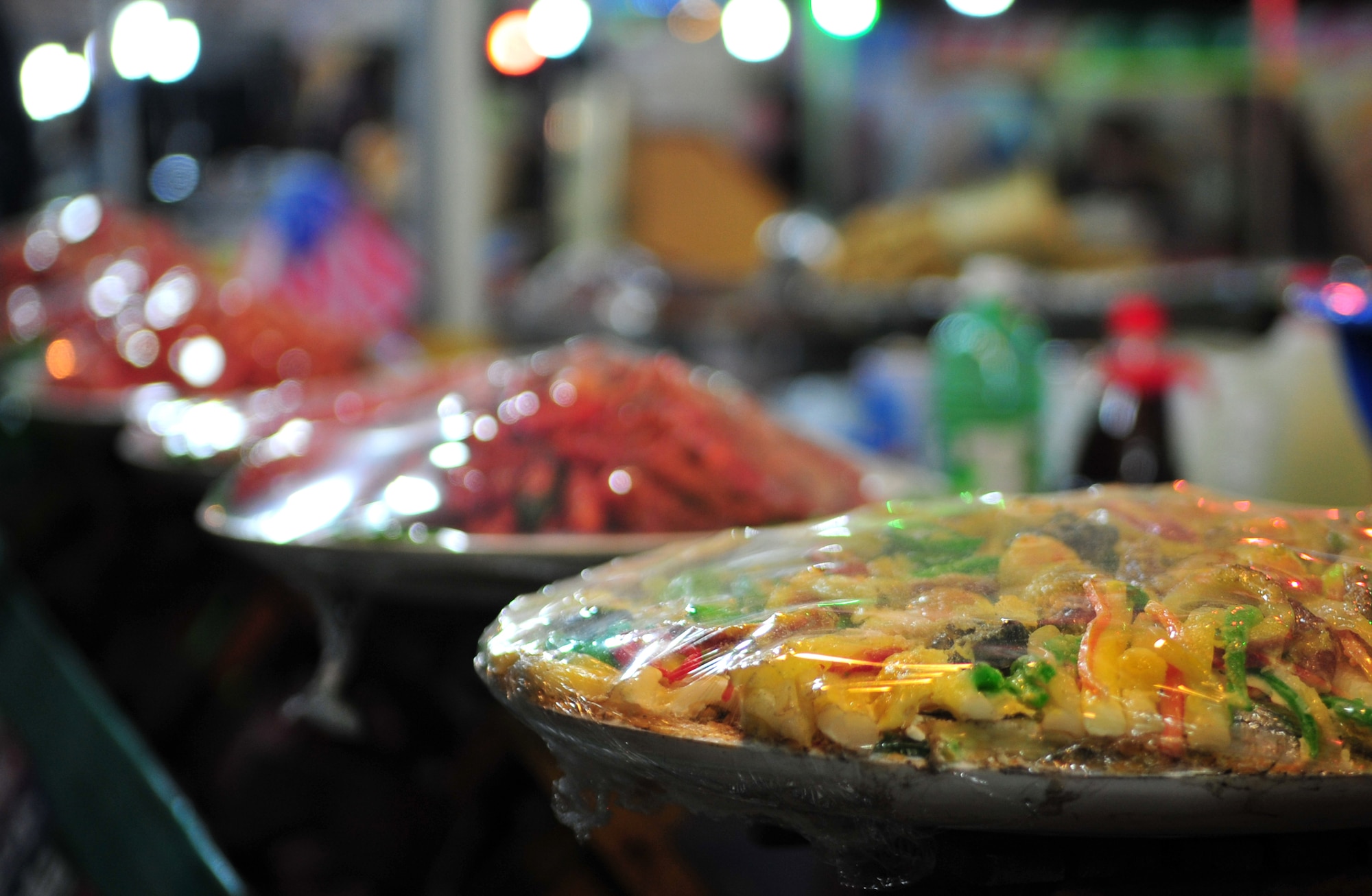 Colorful Korean dishes are lined up for purchase during the 10th Annual Korean-American Friendship Festival in the Songtan Entertainment District, Republic of Korea, Oct. 6, 2013. Several varieties of noodles and desserts, along with fresh roasted meat delighted the senses of those attending the festival. (U.S. Air Force photo/Airman 1st Class Ashley J. Thum)