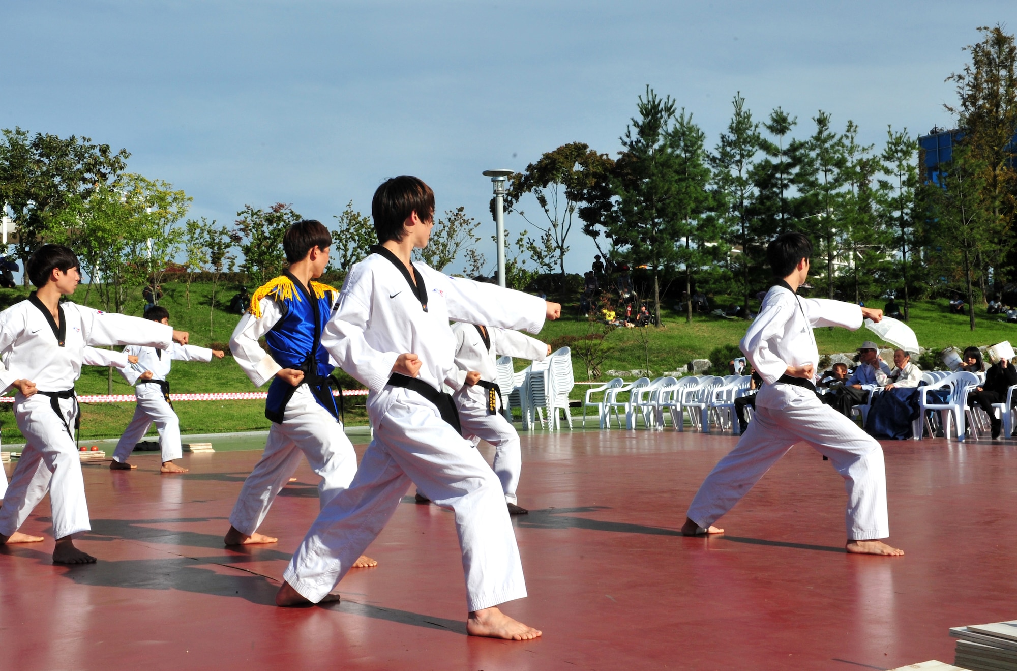 A local Taekwondo group demonstrates their skills as part of the 10th Annual Korean-American Friendship Festival in the Songtan Entertainment District, Republic of Korea, Oct. 5, 2013. Concerts, traditional dances, games and other attractions offered a glimpse into traditional and modern Korean culture. (U.S. Air Force photo/Airman 1st Class Ashley J. Thum)